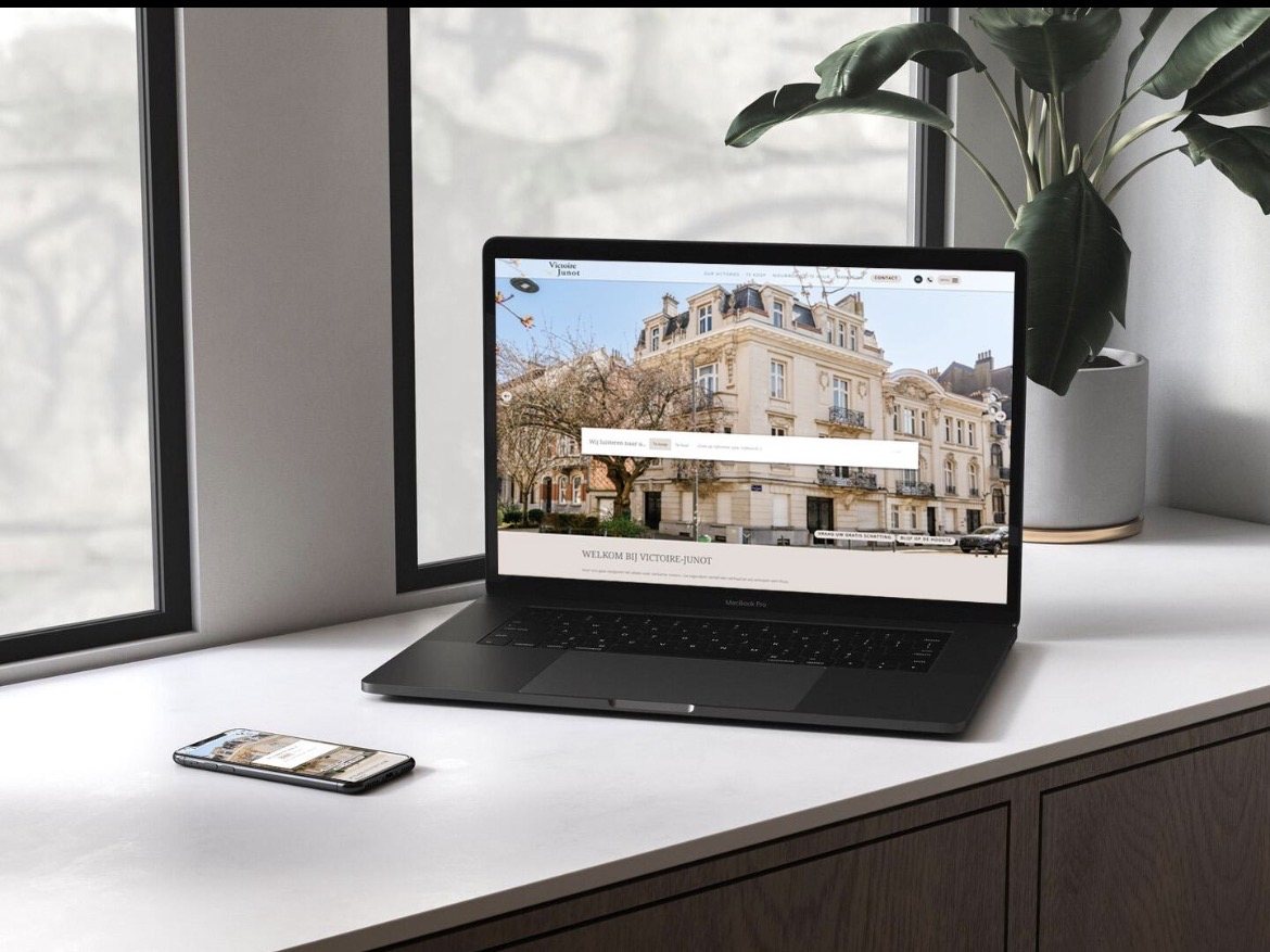 Laptop displaying a luxury real estate website